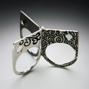 Layered silver ring with 3 parts on a hinge