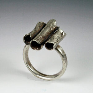 Silver ring with three organic tubes