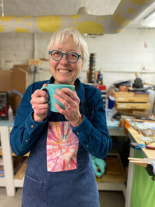 Catherine Davies Paetz holding a mug