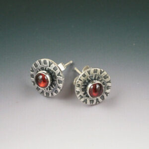Silver circle earrings with garnet center