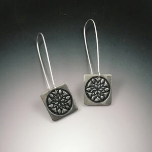 Silver earrings with mandala design