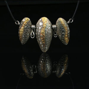 Necklace with three large silver beads