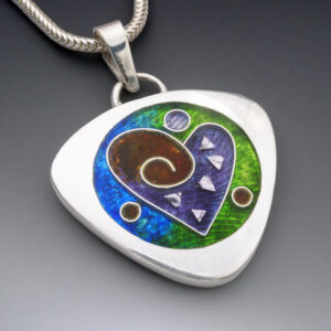 Abstract heart enamel design on a silver pendant