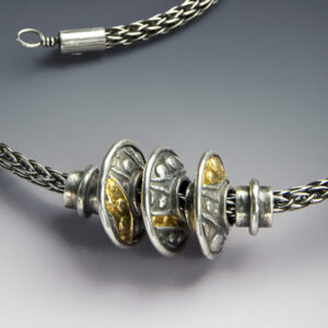Necklace with three silver beads